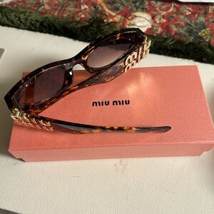 Miu Miu Tortoise Shell Sunglasses with Gold Logo
